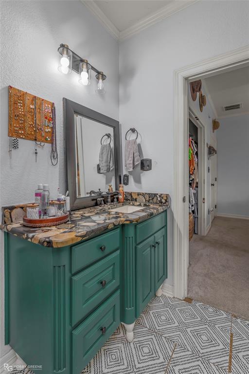 624 Holly Street Grand Cane, LA 71032 - Photo 28 of 40 Bathroom featuring vanity, ornamental molding, and light carpet