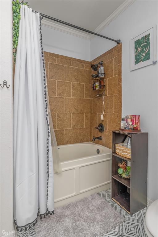 624 Holly Street Grand Cane, LA 71032 - Photo 29 of 40 Bathroom featuring shower / bath combo with shower curtain and ornamental molding
