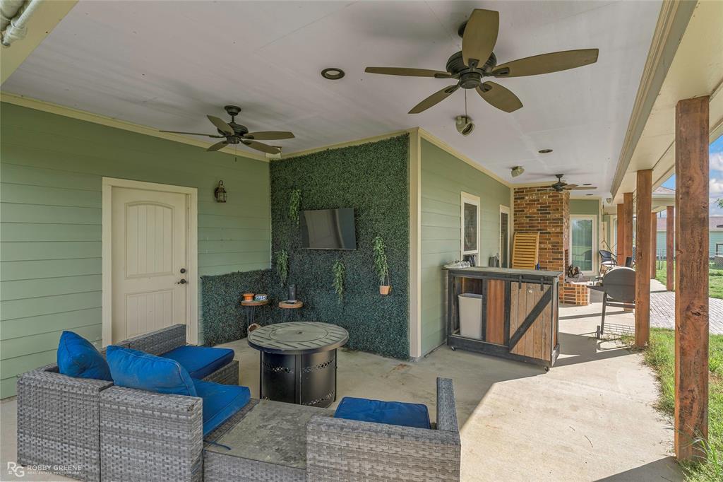 624 Holly Street Grand Cane, LA 71032 - Photo 31 of 40 View of patio with a ceiling fan and outdoor lounge area