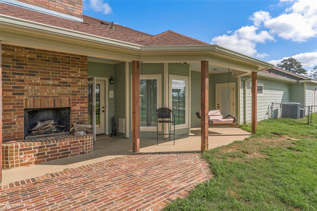 624 Holly Street Grand Cane, LA 71032 - Photo 32 of 40 View of patio with an outdoor brick fireplace