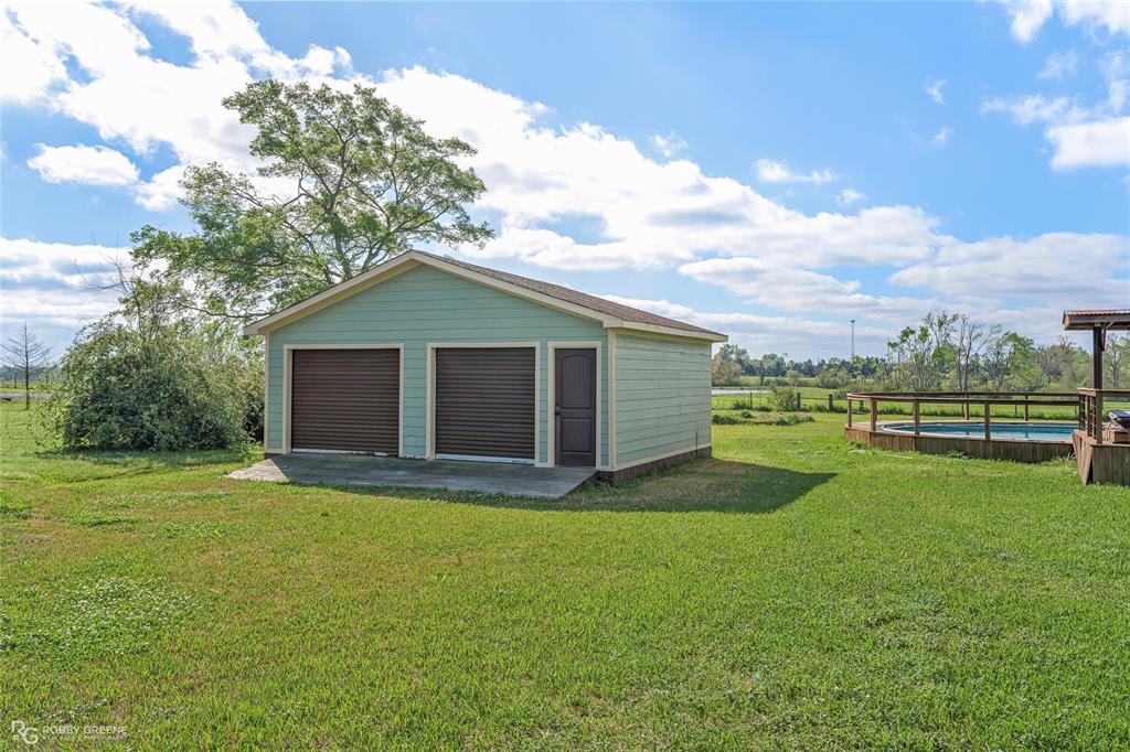 624 Holly Street Grand Cane, LA 71032 - Photo 35 of 40 Detached garage with an outdoor pool