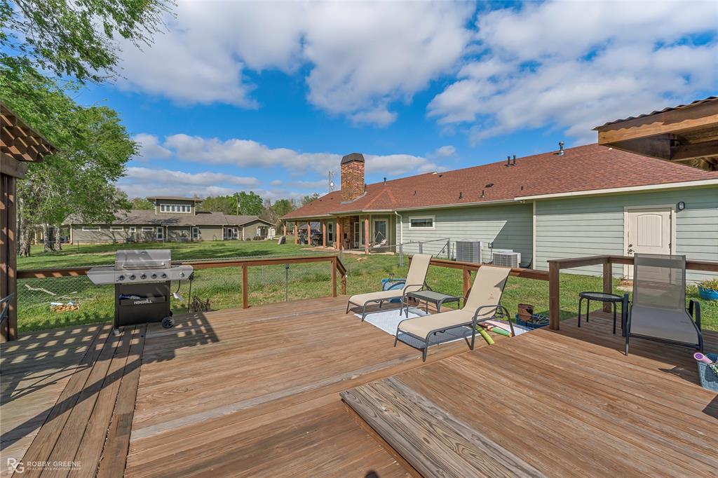 624 Holly Street Grand Cane, LA 71032 - Photo 37 of 40 Wooden deck featuring a yard, area for grilling, and a residential view