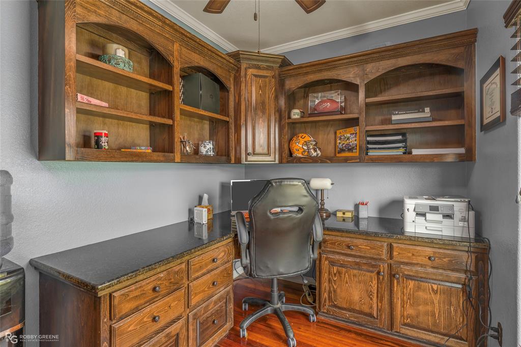 624 Holly Street Grand Cane, LA 71032 - Photo 10 of 40 Office featuring built in study area, dark wood-style flooring, crown molding, and ceiling fan