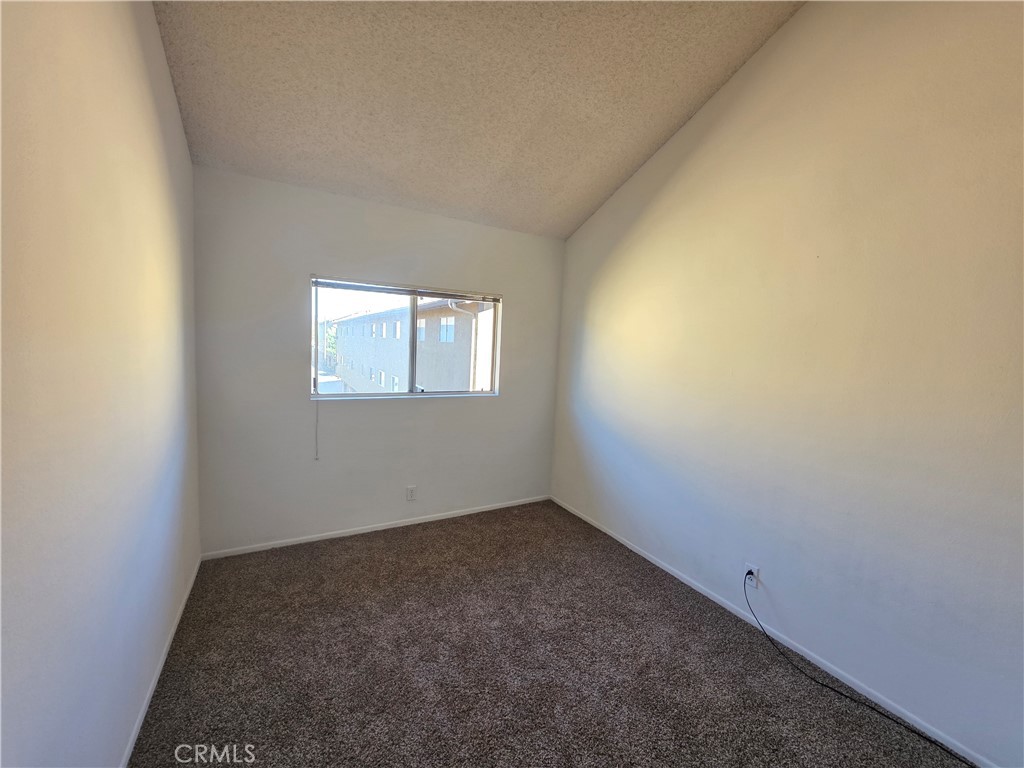 14839 Sherman Way, Unit 6 Van Nuys, CA 91405 - Photo 13 of 23 an empty room with a window