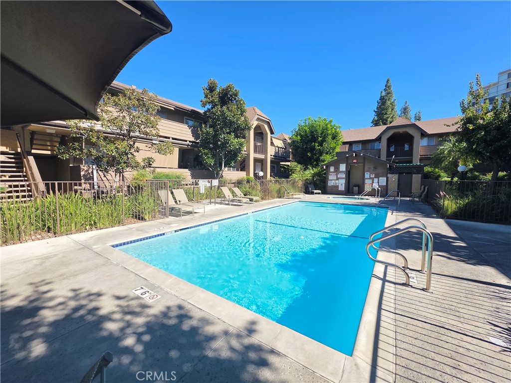 14839 Sherman Way, Unit 6 Van Nuys, CA 91405 - Photo 21 of 23 a view of a house with swimming pool