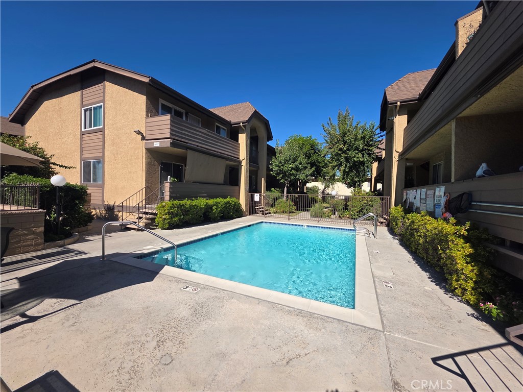 14839 Sherman Way, Unit 6 Van Nuys, CA 91405 - Photo 23 of 23 a front view of a house with a yard