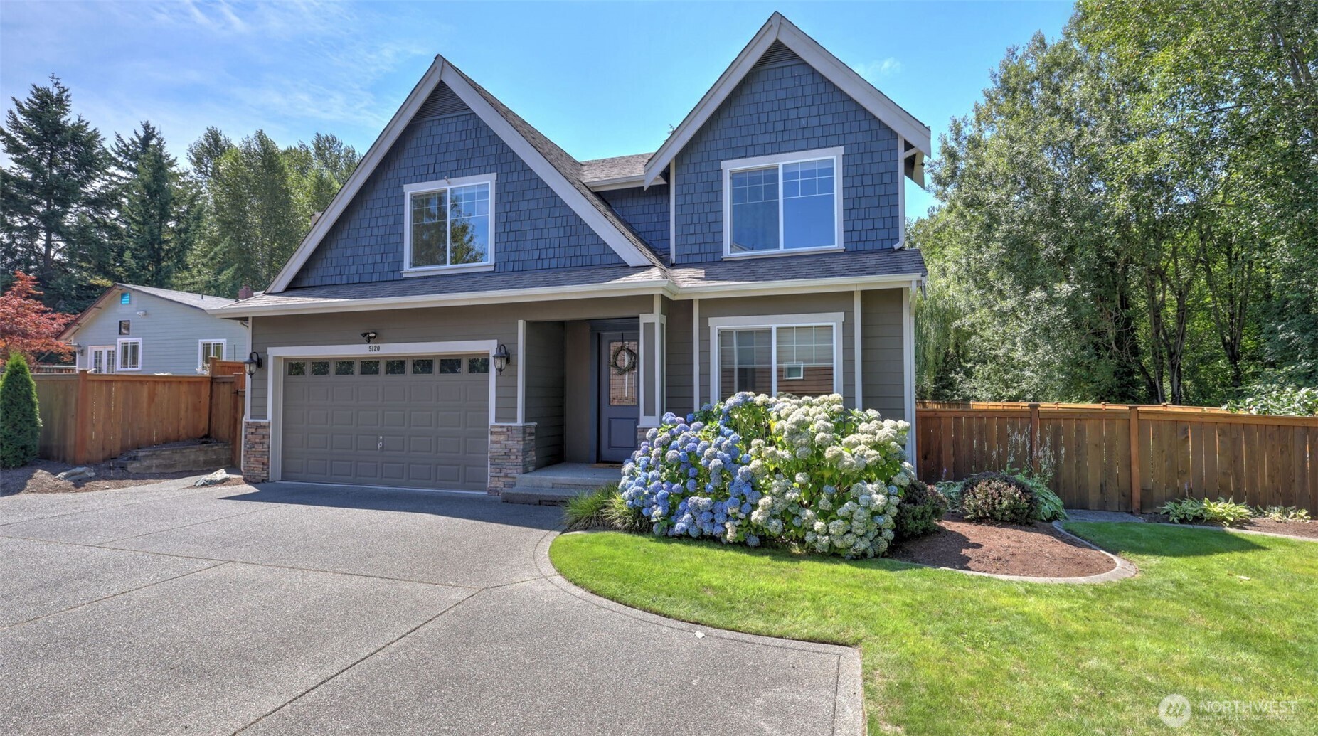 5120 Northeast 9th Place Renton, WA 98059 - Photo 35 of 35 a front view of a house with a yard and garage
