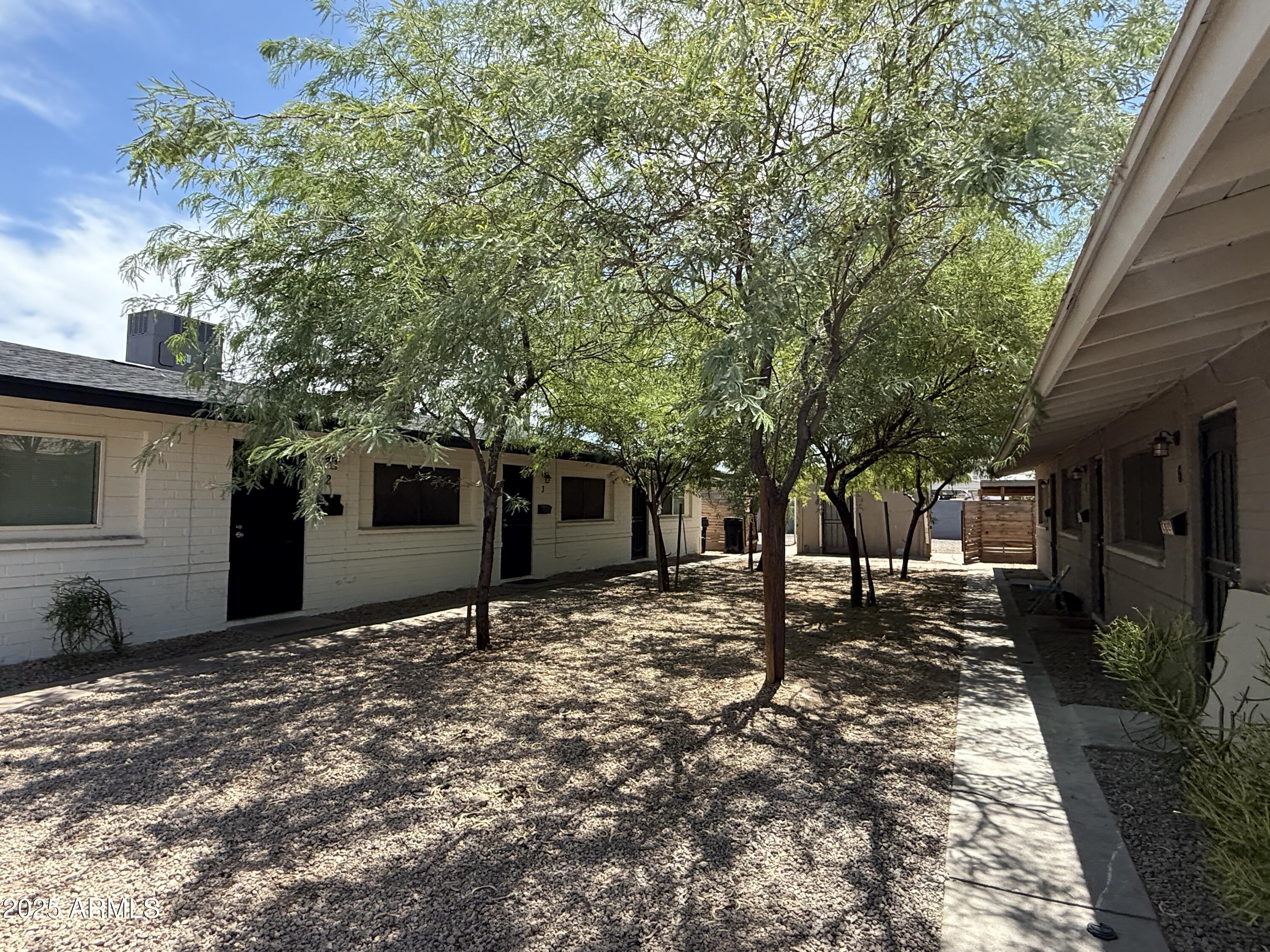 1625 West Fillmore Street, Unit 1 Phoenix, AZ 85007 - Photo 1 of 10 a backyard of a house with seating space
