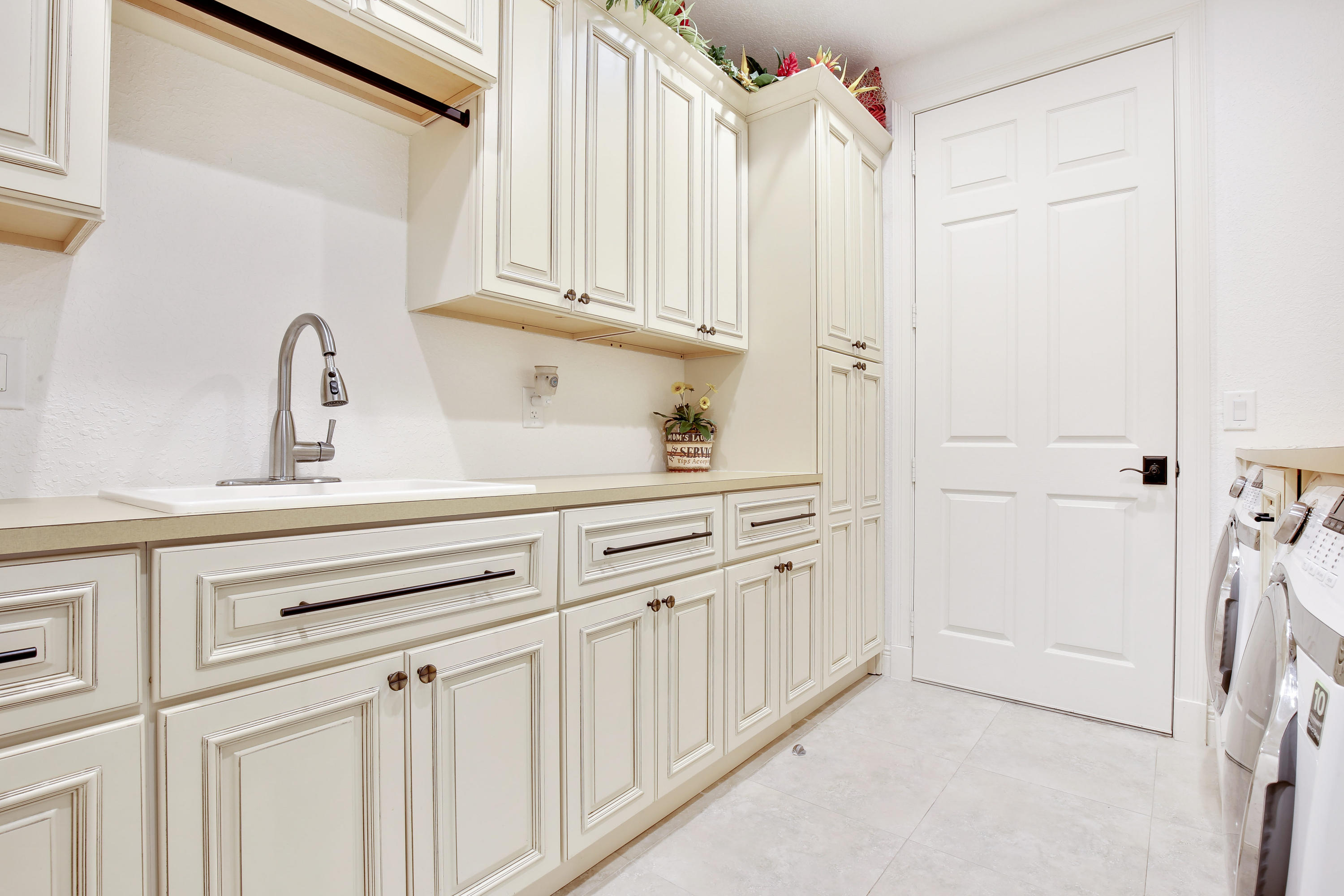 311 Center Street Jupiter, FL 33458 - Photo 19 of 30 Laundry Room w/ Sink & Great Storage