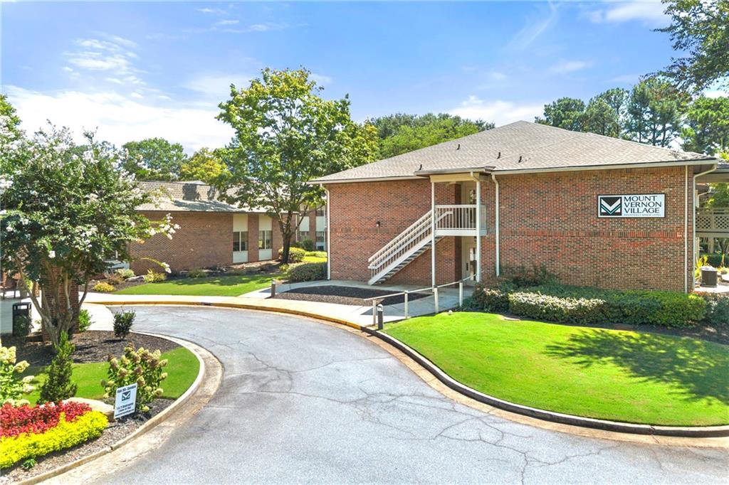 475 Mount Vernon Highway Northeast, Unit 226C Atlanta, GA 30328 - Photo 1 of 24 a view of a house with a yard potted plants