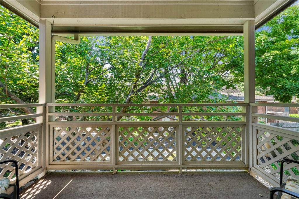 475 Mount Vernon Highway Northeast, Unit 226C Atlanta, GA 30328 - Photo 13 of 24 a front view of a house with a yard