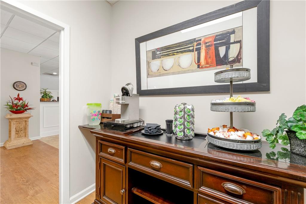 475 Mount Vernon Highway Northeast, Unit 226C Atlanta, GA 30328 - Photo 18 of 24 a kitchen with a potted plant on the counter and cabinets