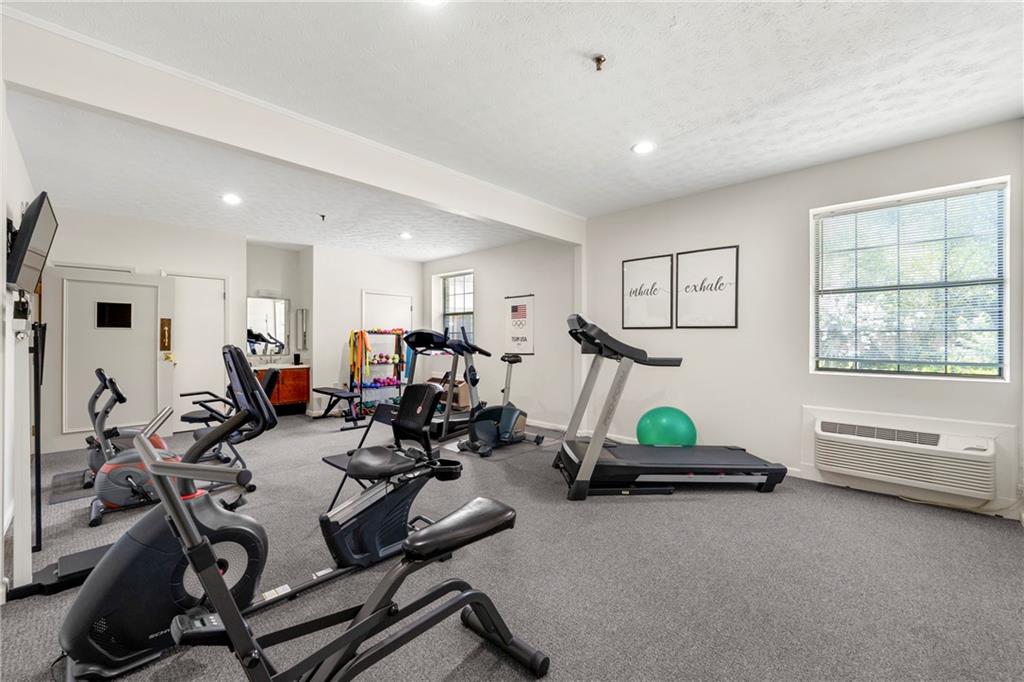 475 Mount Vernon Highway Northeast, Unit 226C Atlanta, GA 30328 - Photo 19 of 24 a view of a room with gym equipment