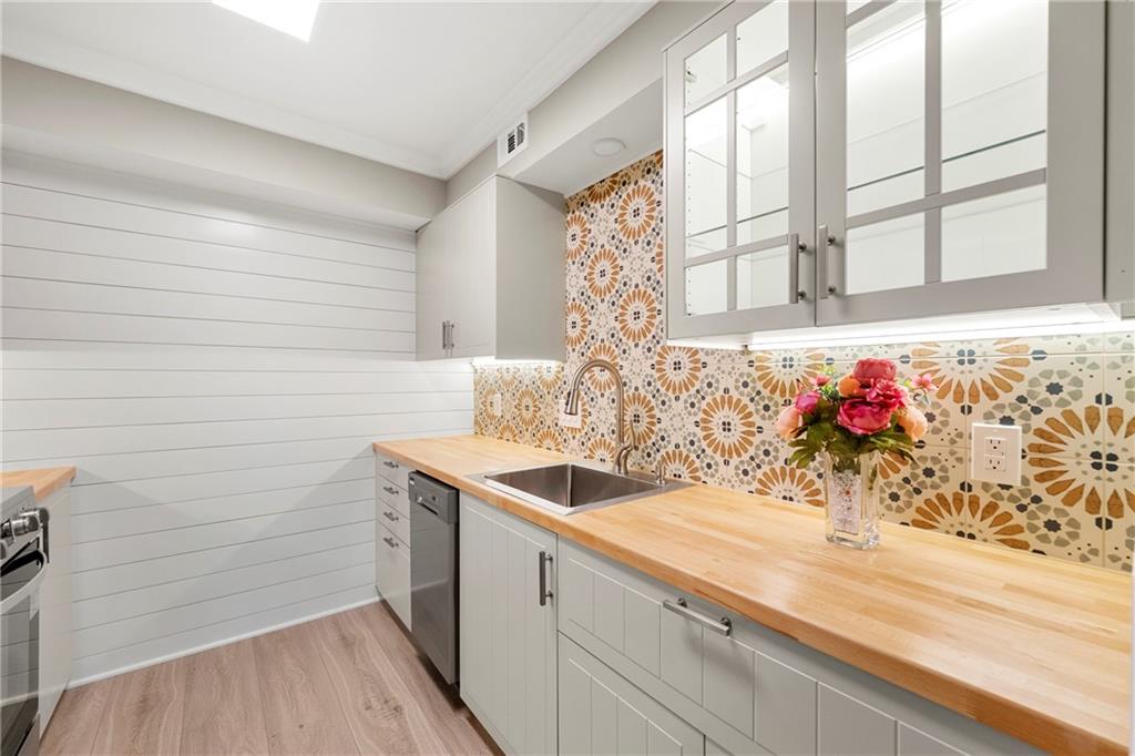 475 Mount Vernon Highway Northeast, Unit 226C Atlanta, GA 30328 - Photo 5 of 24 a bathroom with a sink and a bathtub