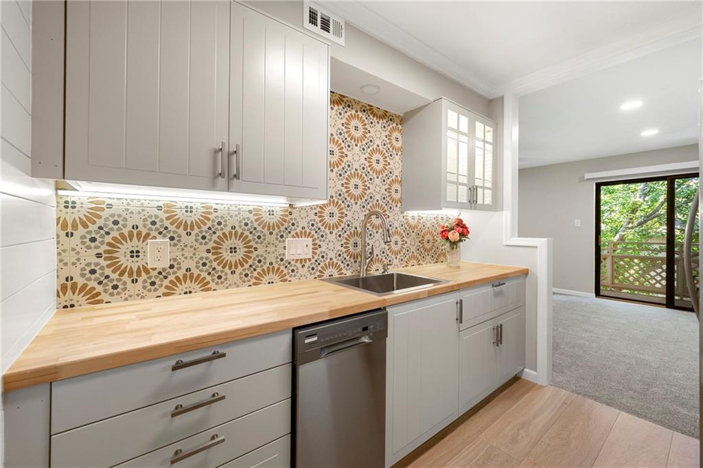 475 Mount Vernon Highway Northeast, Unit 226C Atlanta, GA 30328 - Photo 7 of 24 a bathroom with a sink and a mirror