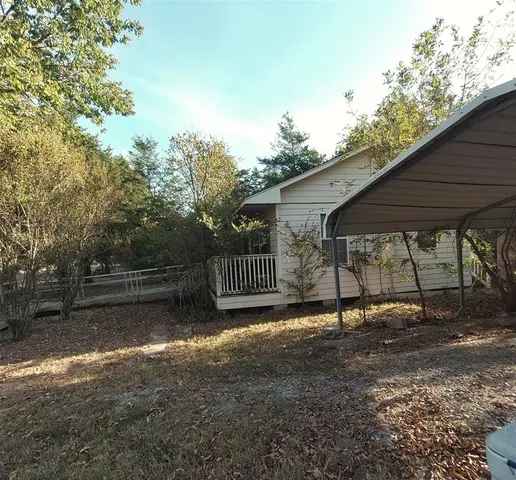 a view of backyard with green space