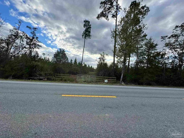 a view of a lake with houses in the background