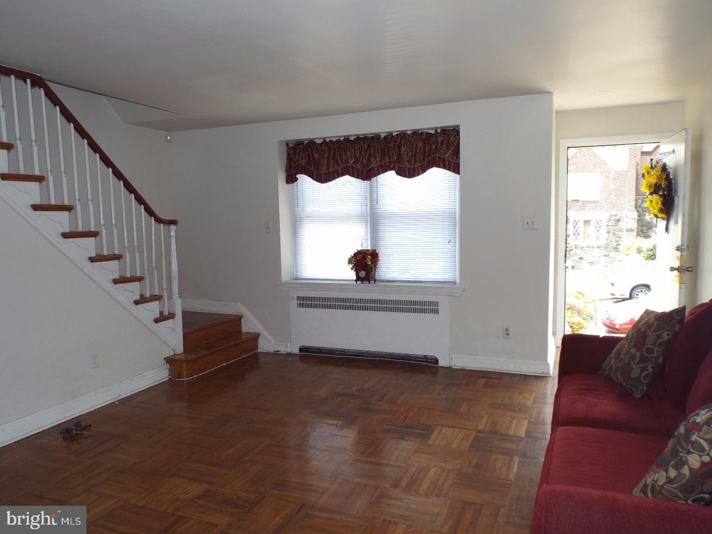 105 Ashton Road Upper Darby, PA 19082 - Photo 3 of 15 a living room with furniture and a window