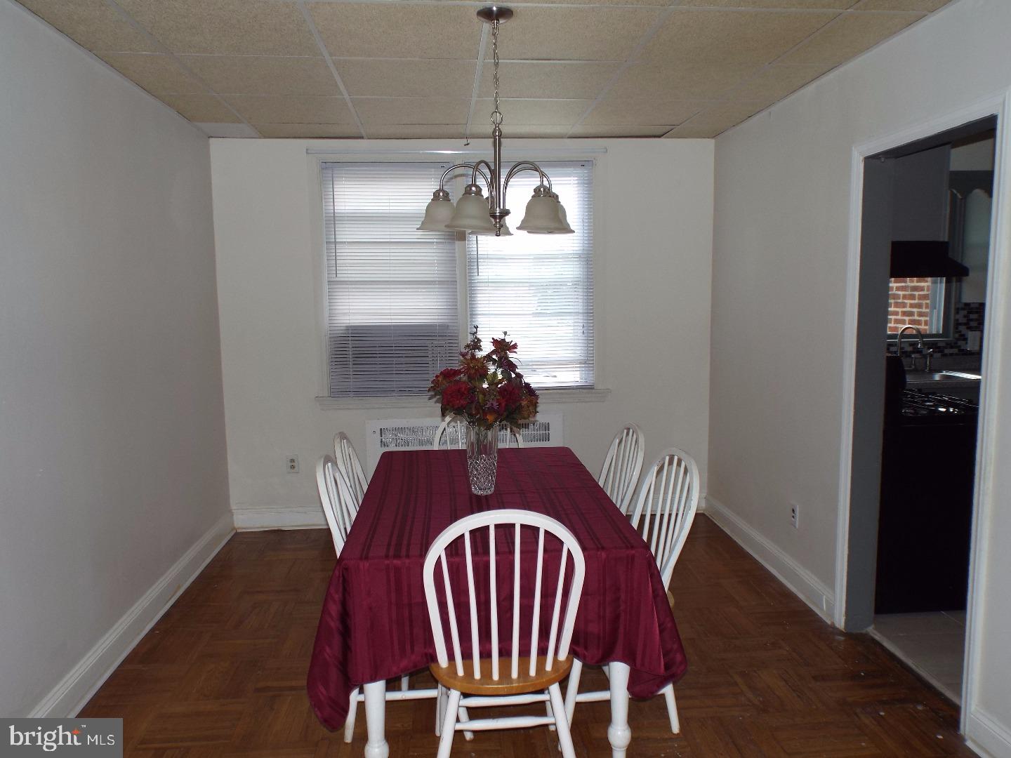 105 Ashton Road Upper Darby, PA 19082 - Photo 6 of 15 a view of a dining room with furniture wooden floor and chandelier
