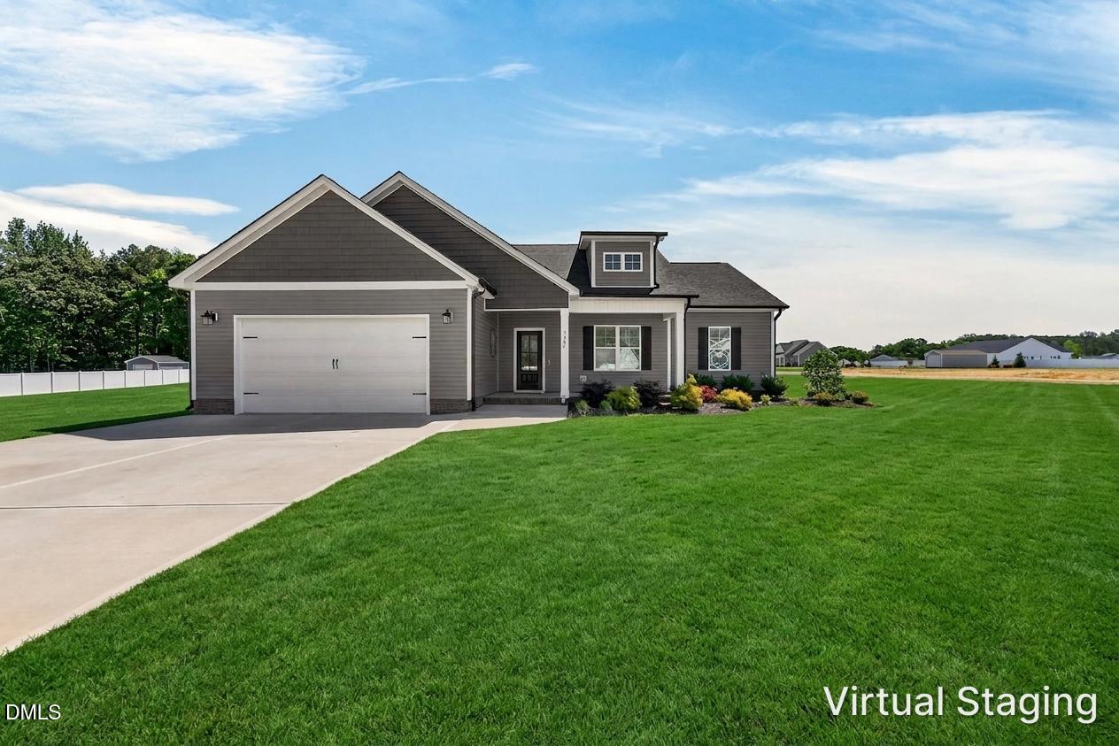 9205 Raccoon Drive Middlesex, NC 27557 - Photo 1 of 20 a front view of a house with a yard