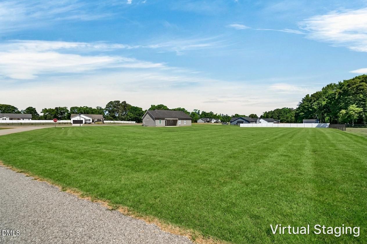 9205 Raccoon Drive Middlesex, NC 27557 - Photo 20 of 20 a view of a golf course with a garden