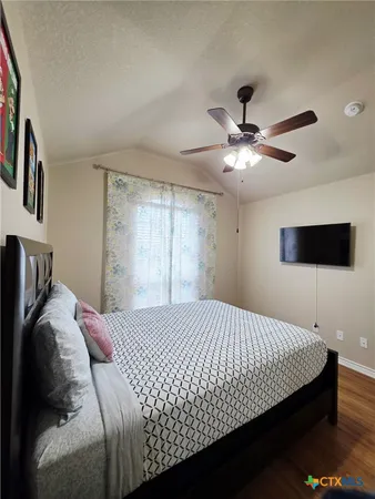 a living room with furniture a fireplace and a chandelier