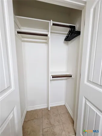 a bathroom with a double vanity sink mirror and toilet