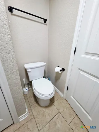 a bathroom with a sink mirror and shower