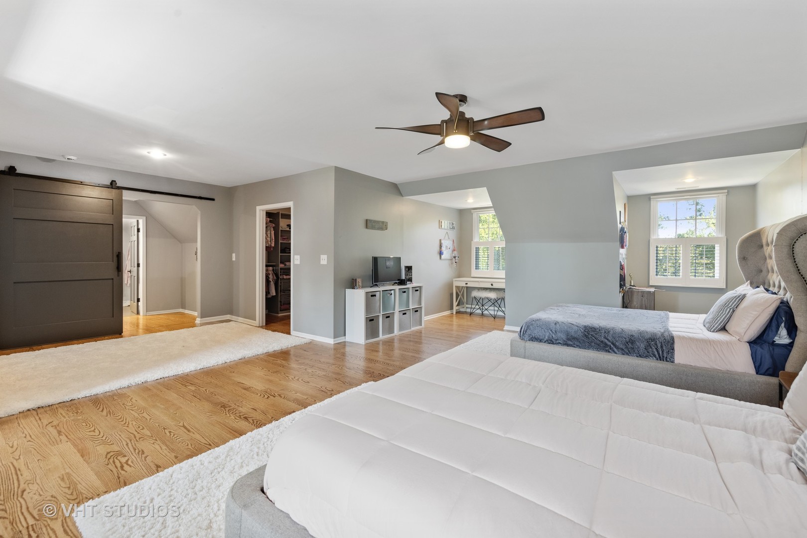 32W651 Honey Hill Circle Wayne, IL 60184 - Photo 32 of 49 a bedroom with a large bed and ceiling fan