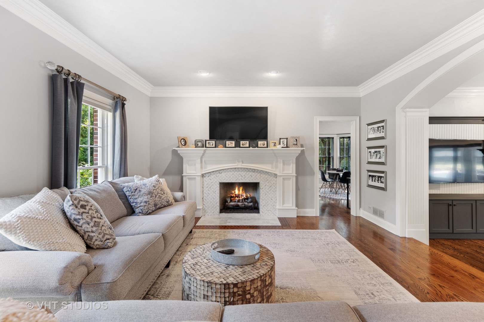 32W651 Honey Hill Circle Wayne, IL 60184 - Photo 4 of 49 a living room with furniture a flat screen tv and a fireplace