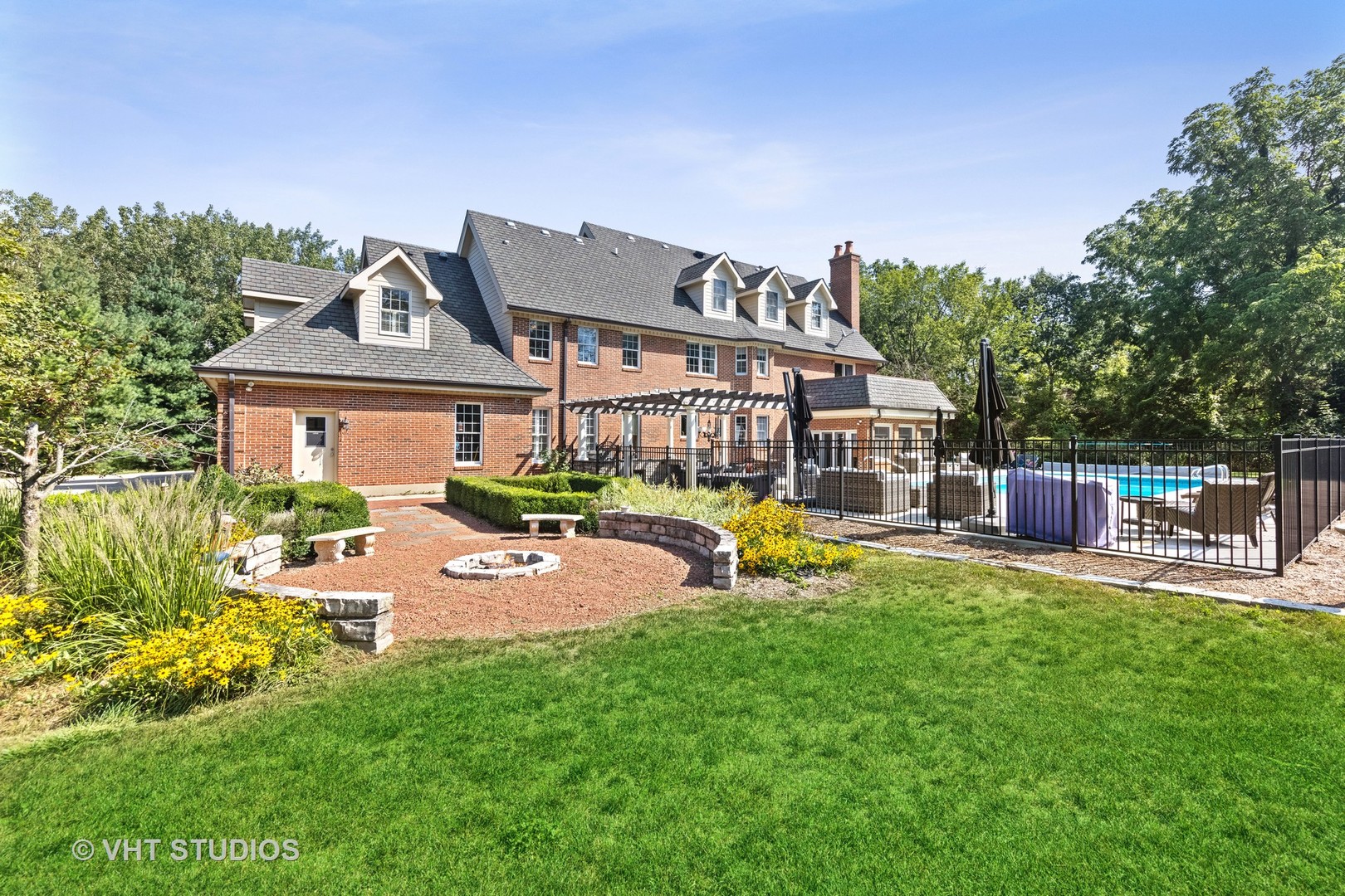 32W651 Honey Hill Circle Wayne, IL 60184 - Photo 41 of 49 a front view of a house with garden and patio