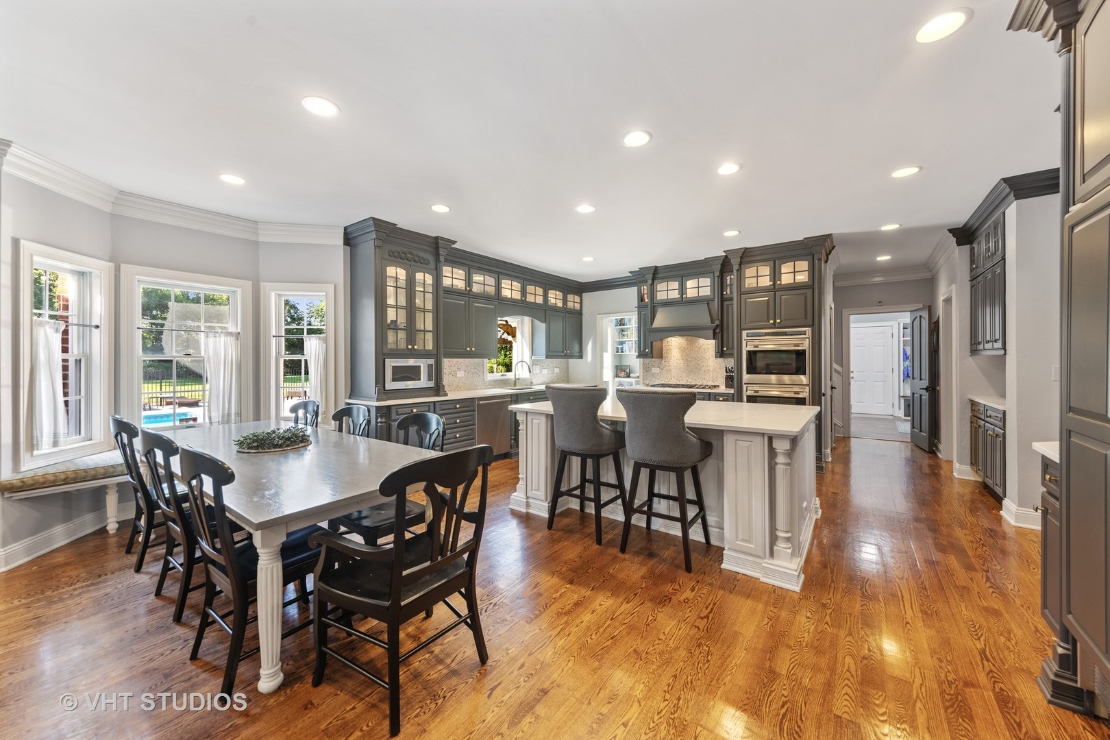 32W651 Honey Hill Circle Wayne, IL 60184 - Photo 10 of 49 a view of a dining room with furniture and wooden floor