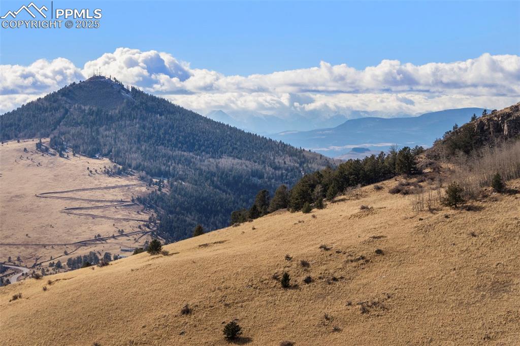 Private Road Cripple Creek, CO 80813 - Photo 15 of 19 a view of a dry yard with wooden fence