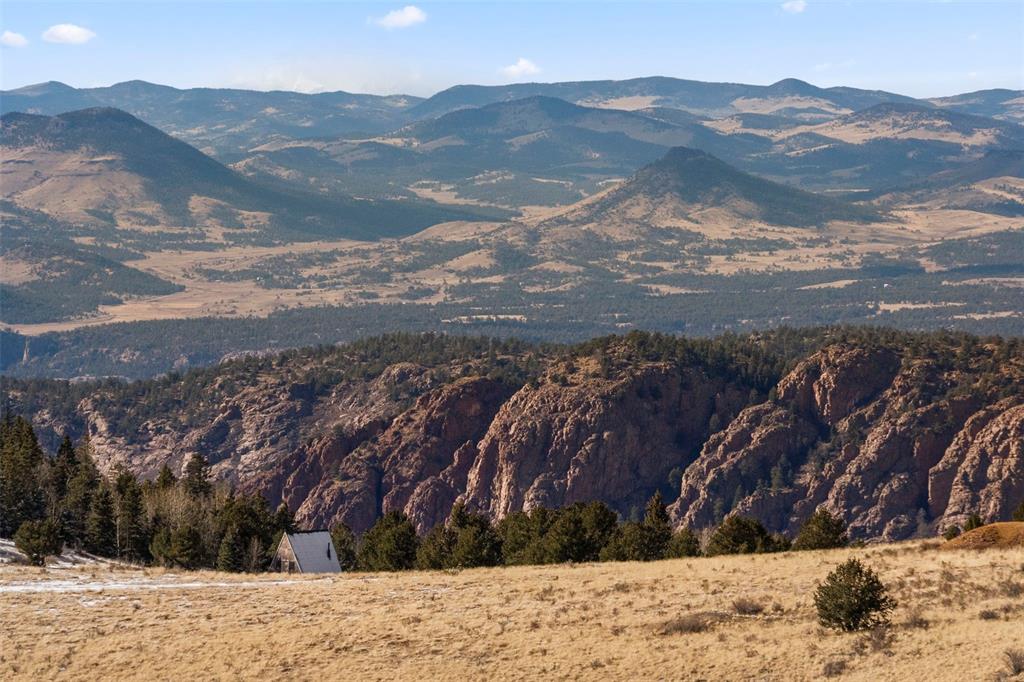 Private Road Cripple Creek, CO 80813 - Photo 19 of 19 a view of a yard with mountains in the background