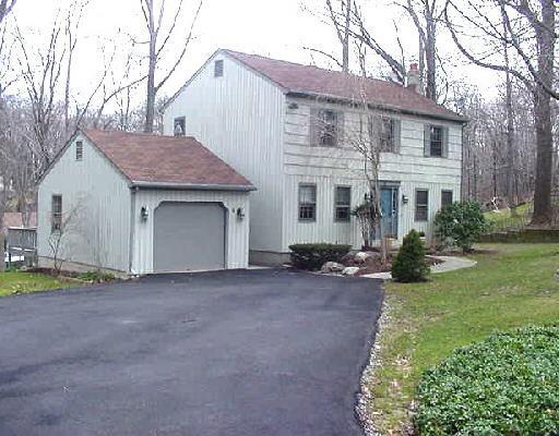 6 Devils Garden Road Norwalk, CT 06854 - Photo 1 of 1 a view of a house with a garden and yard