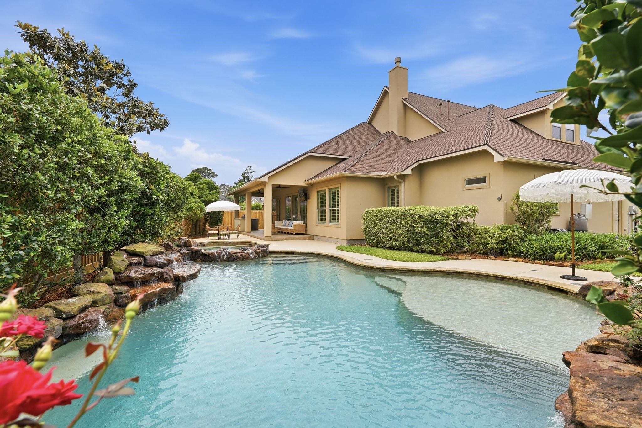 7603 Hogan Bridge Court Spring, TX 77389 - Photo 43 of 50 Resort-style pool and spa with a picturesque view of the home, creating a true backyard retreat.