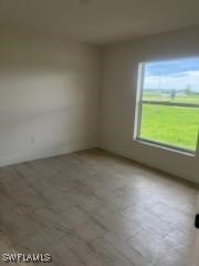 801 Southwest Raintree Boulevard LaBelle, FL 33935 - Photo 4 of 15 a view of an empty room with a window