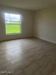 801 Southwest Raintree Boulevard LaBelle, FL 33935 - Photo 5 of 15 a view of an empty room with a window