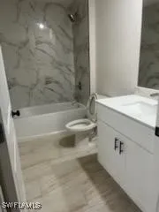 a bathroom with a sink a toilet and a bathtub