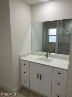 a bathroom with a sink and a mirror