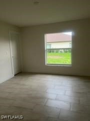801 Southwest Raintree Boulevard LaBelle, FL 33935 - Photo 9 of 15 a view of an empty room with a window