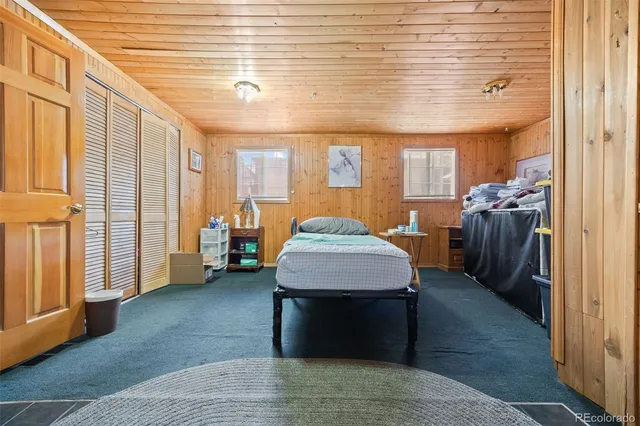 a living room with furniture and a entryway