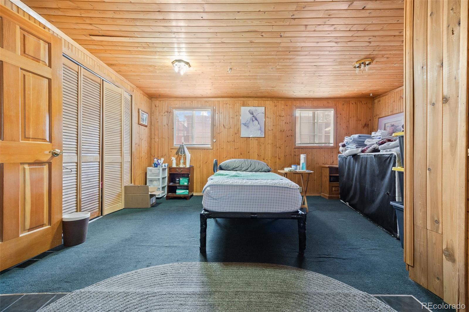 9129 Rampart Street Denver, CO 80260 - Photo 18 of 27 a living room with furniture and a entryway