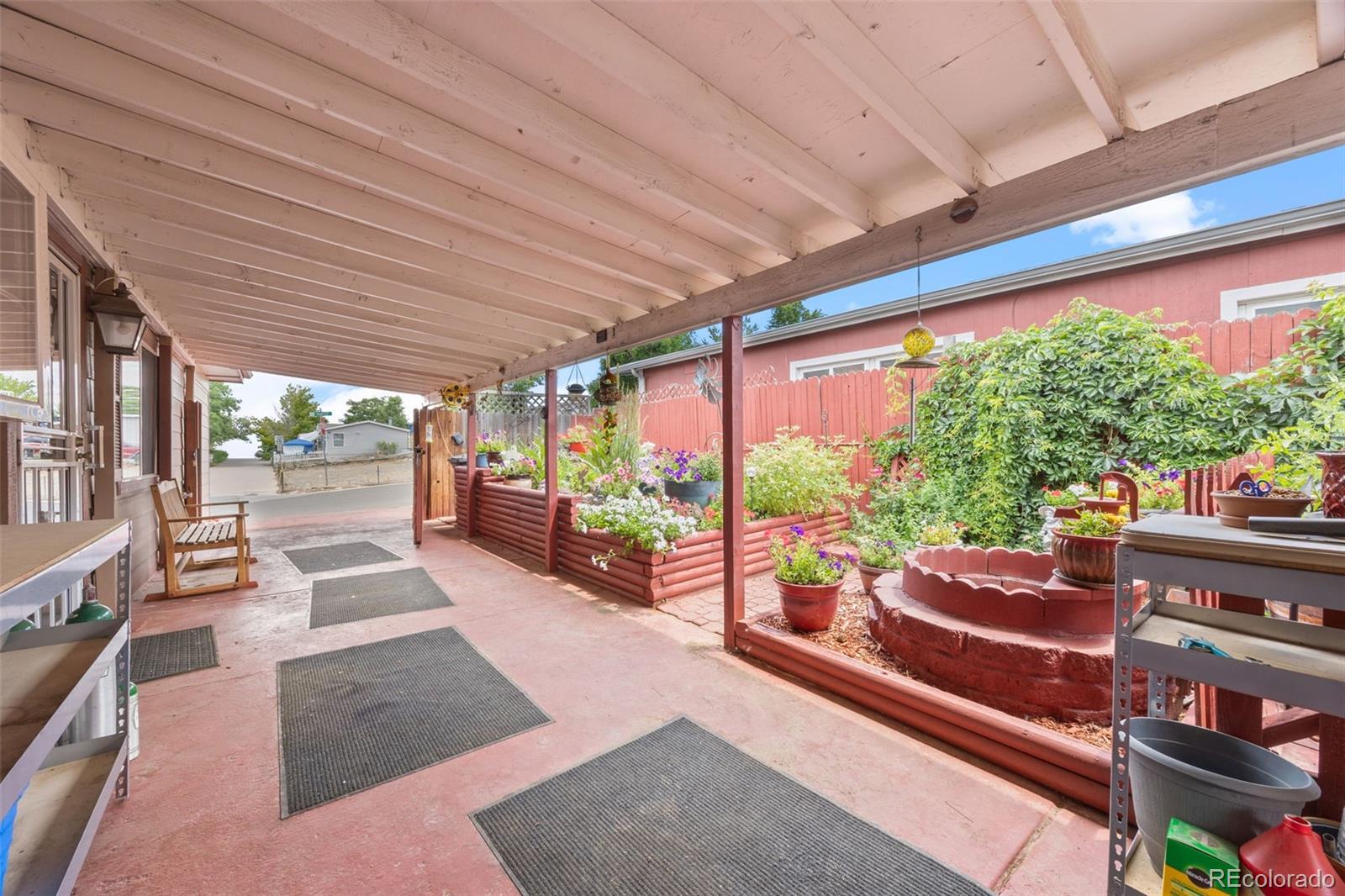 9129 Rampart Street Denver, CO 80260 - Photo 22 of 27 a outdoor space with chairs