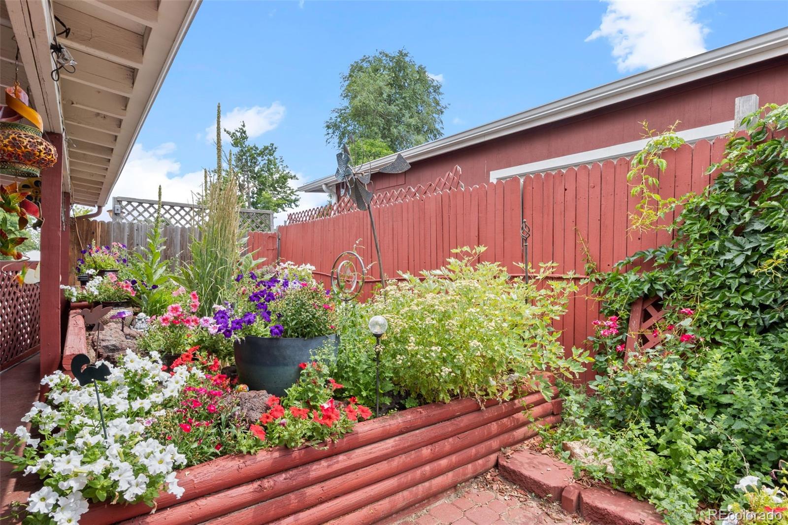 9129 Rampart Street Denver, CO 80260 - Photo 23 of 27 a view of a garden with flowers
