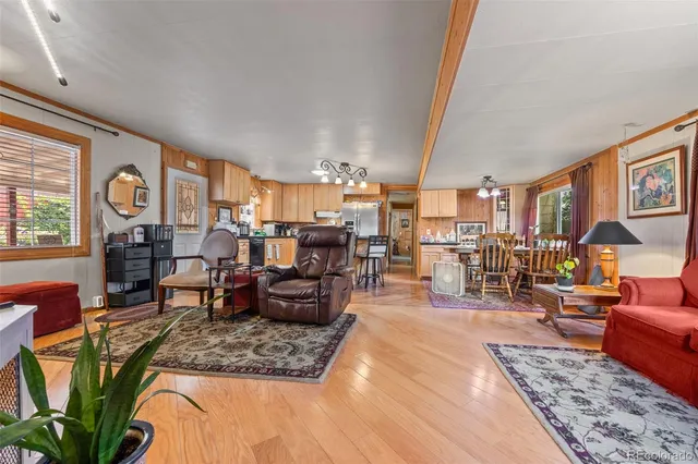 a living room with furniture fireplace and a table
