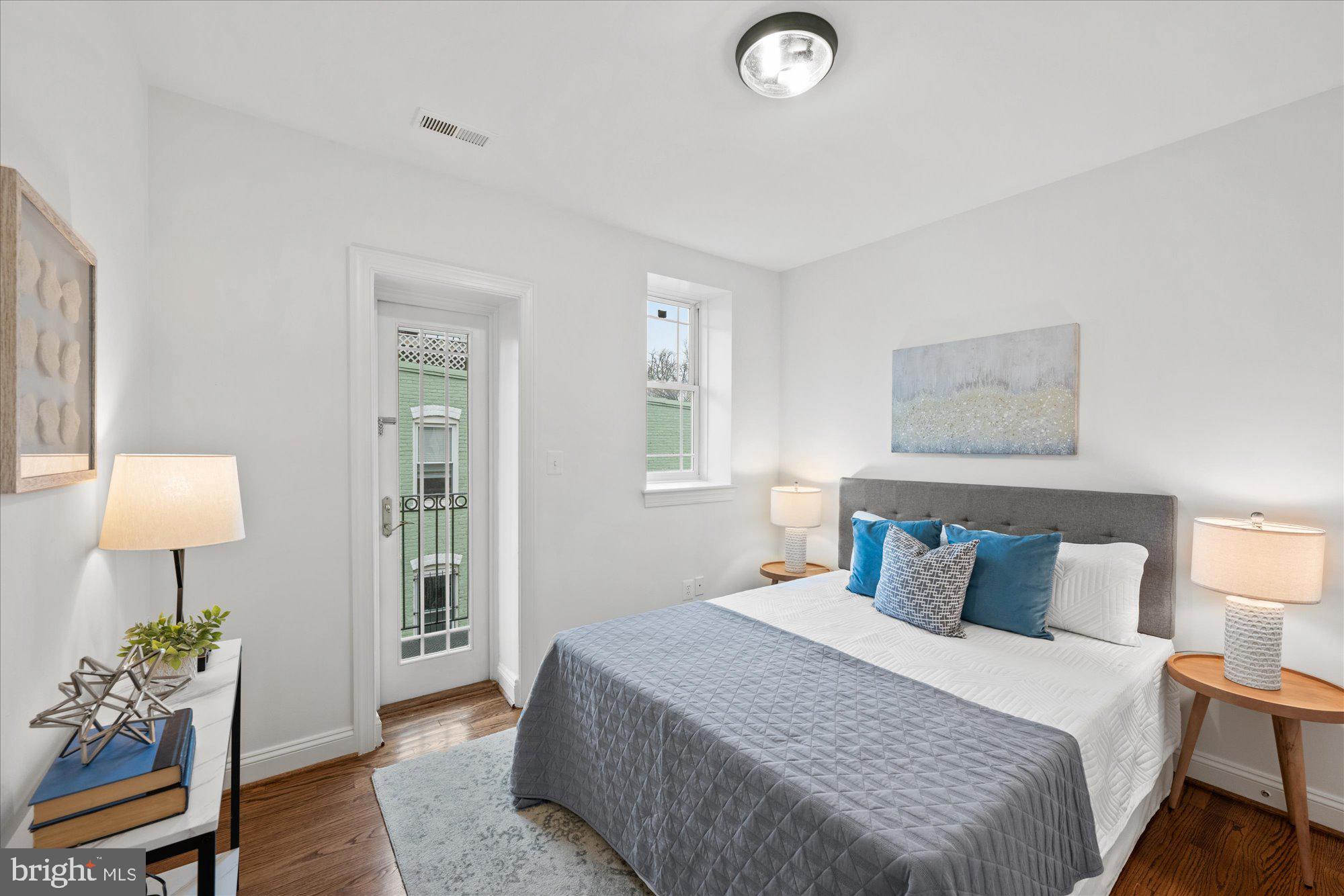 660 Morton Place Northeast, Unit 5 Washington, DC 20002 - Photo 14 of 21 a bedroom with a bed and a table