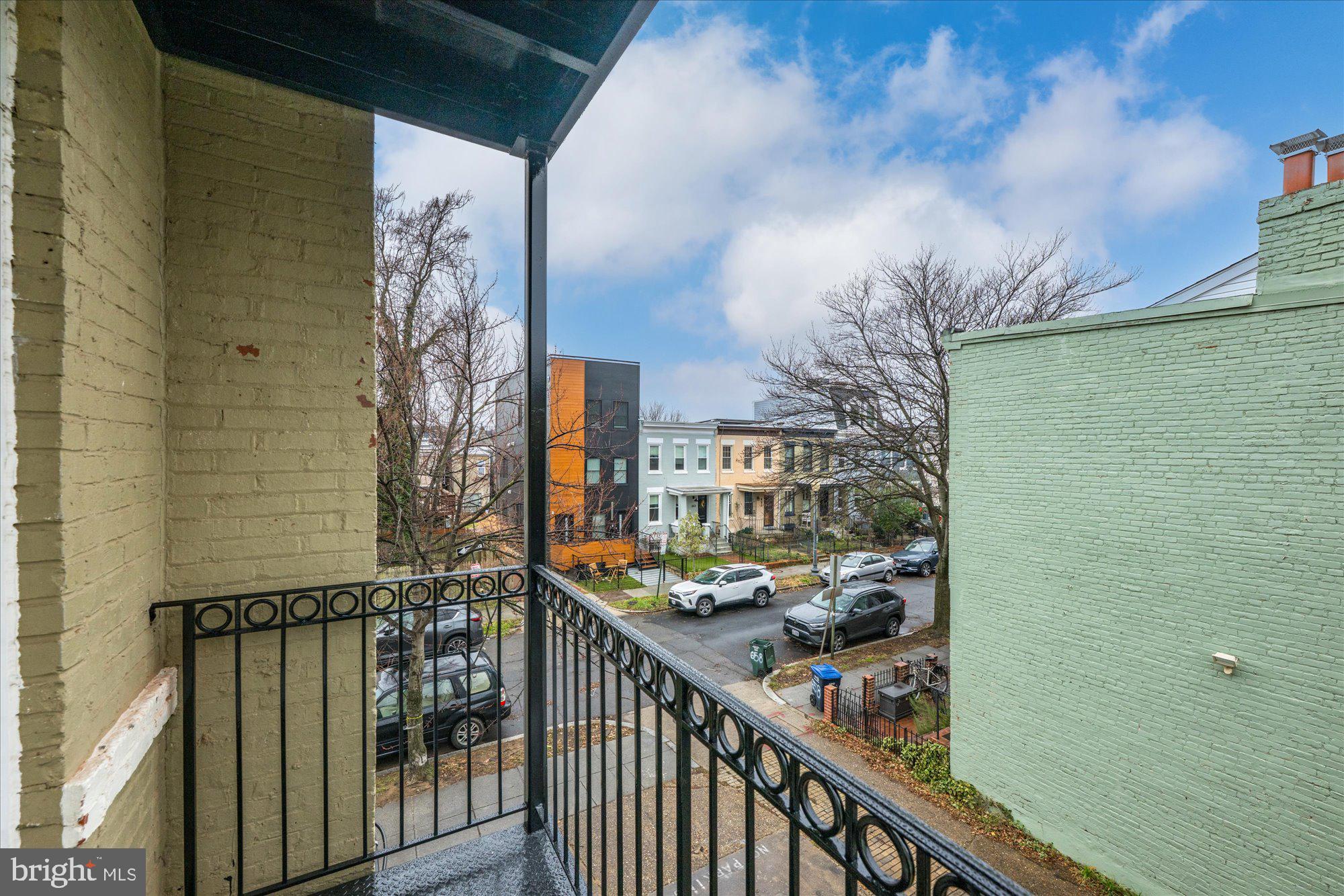 660 Morton Place Northeast, Unit 5 Washington, DC 20002 - Photo 15 of 21 a view of a balcony with wooden floor and stairs