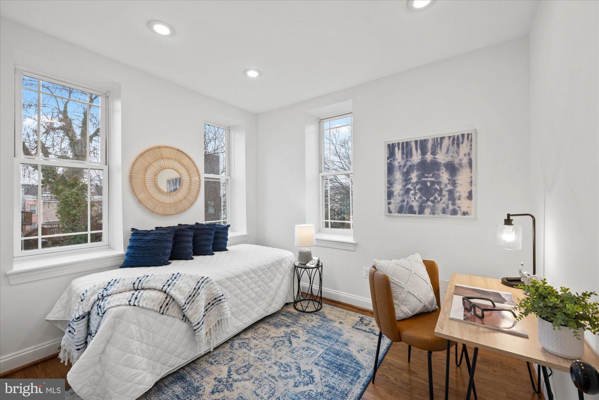 660 Morton Place Northeast, Unit 5 Washington, DC 20002 - Photo 16 of 21 a bedroom with a bed and a window