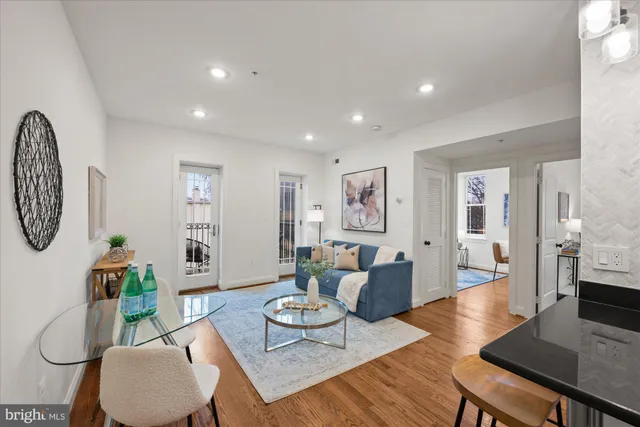 a living room with furniture and a table